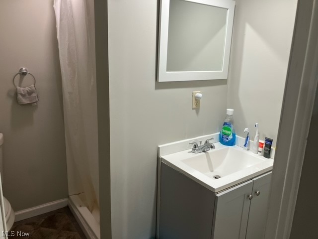 3808 Delmore Road Cleveland, OH 44121 - Photo 23 of 27 Bathroom with vanity, walk in shower, and tile flooring