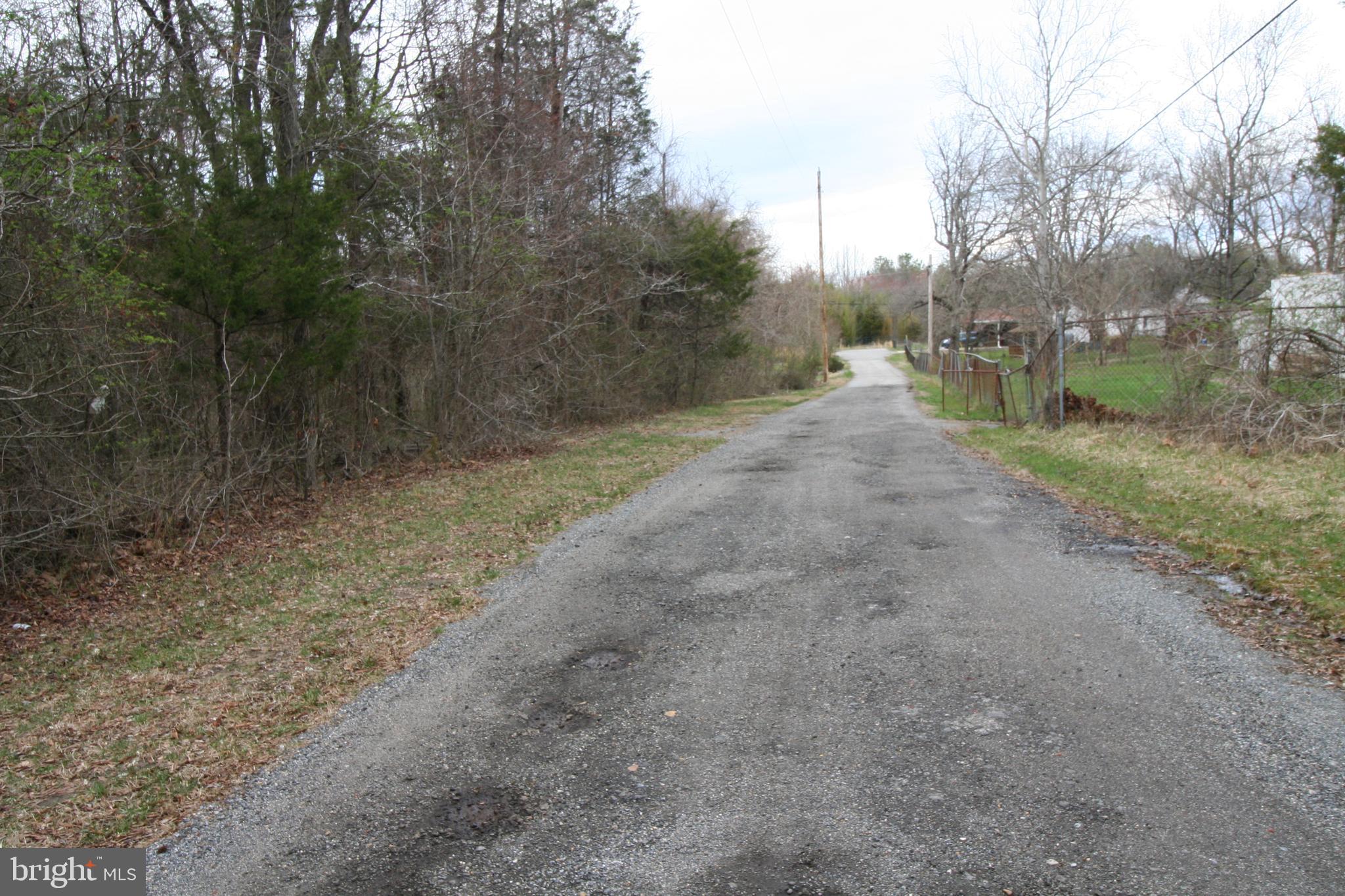 0 Floral Park Road Brandywine, MD 20613 - Photo 4 of 7 a view of a dirt road with trees in the background