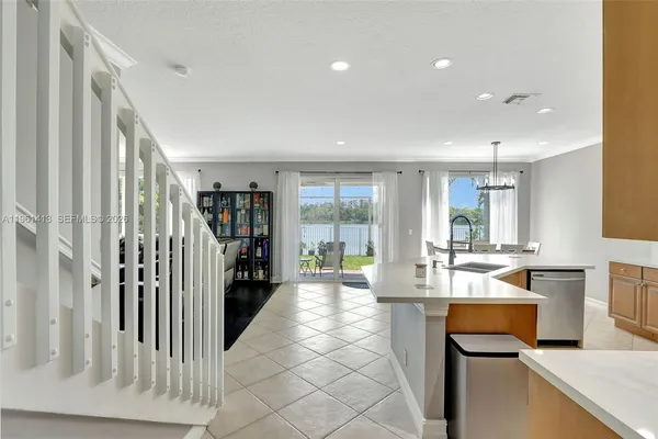 a lobby with furniture and large window