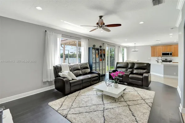 a living room with furniture and a large window