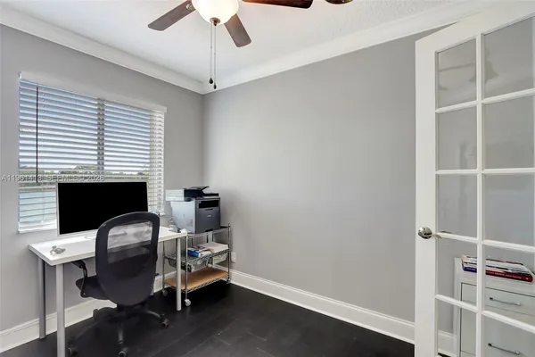 a view of a workspace with furniture and a fireplace