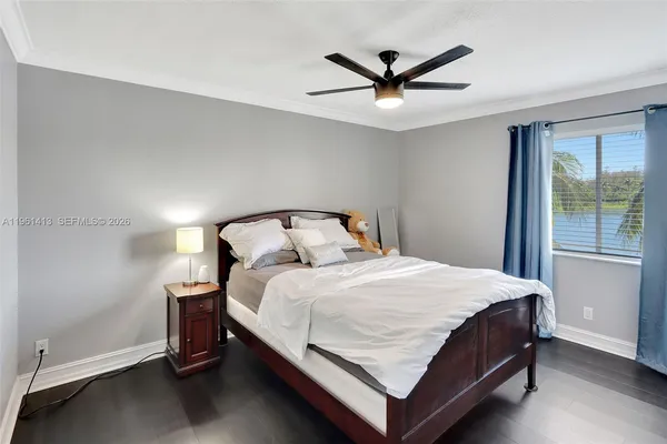 a bedroom with a bed and window