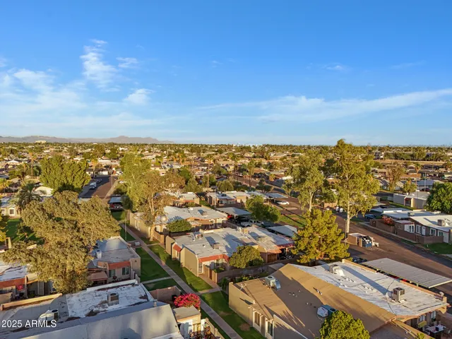 an aerial view of residential building with ocean view