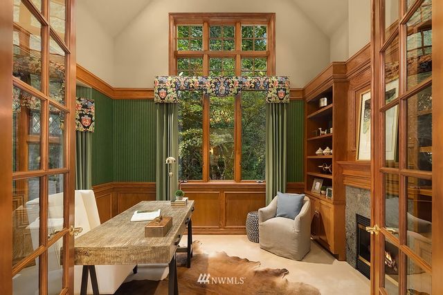 a balcony with furniture and a large window