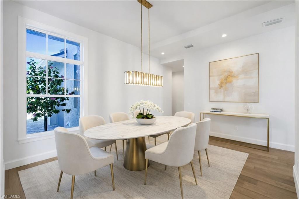 16716 Enclave Circle Naples, FL 34110 - Photo 18 of 50 Dining area featuring light wood-style flooring and recessed lighting