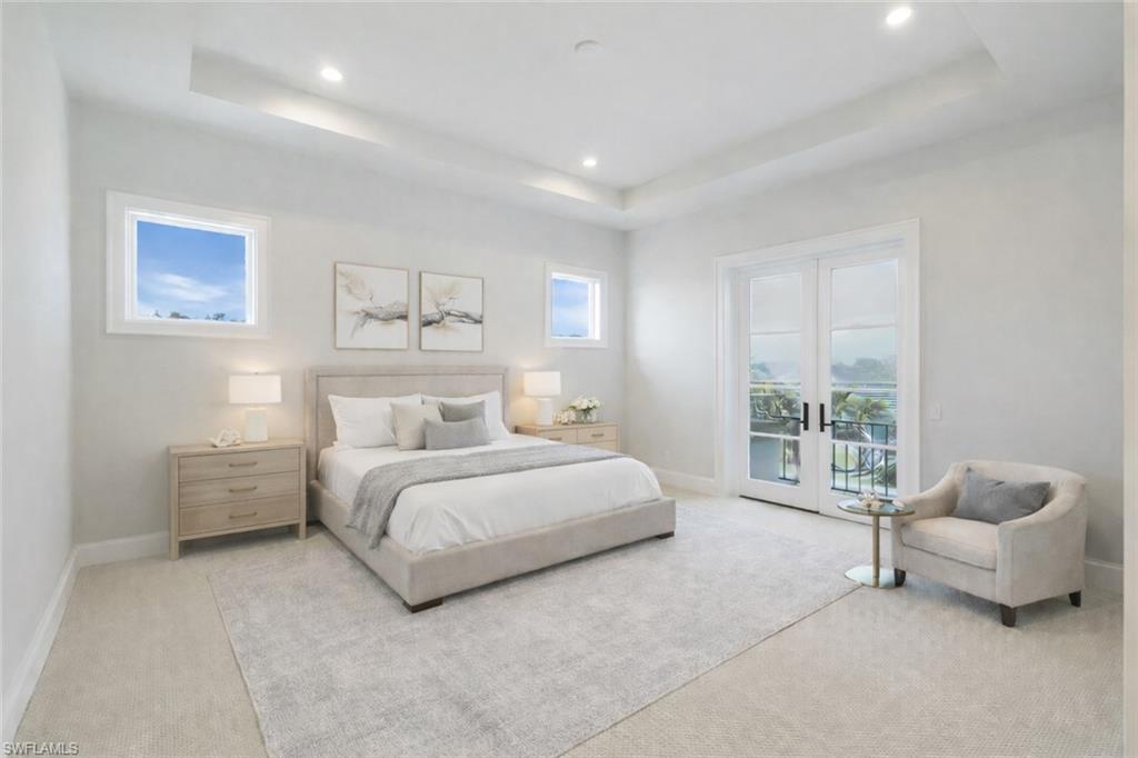 16716 Enclave Circle Naples, FL 34110 - Photo 36 of 50 Bedroom featuring french doors, access to outside, light carpet, a tray ceiling, and recessed lighting