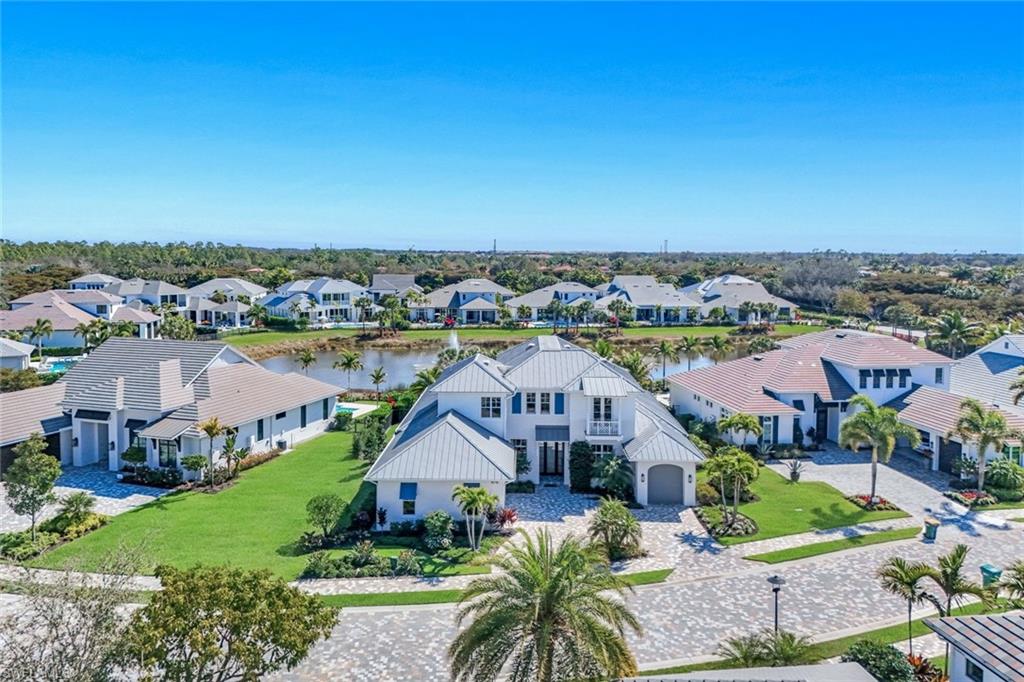 16716 Enclave Circle Naples, FL 34110 - Photo 4 of 50 Aerial view of residential area with a large body of water