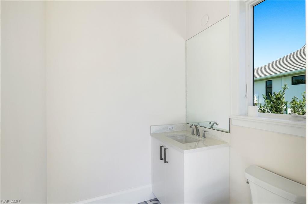 16716 Enclave Circle Naples, FL 34110 - Photo 44 of 50 Bathroom with toilet and vanity