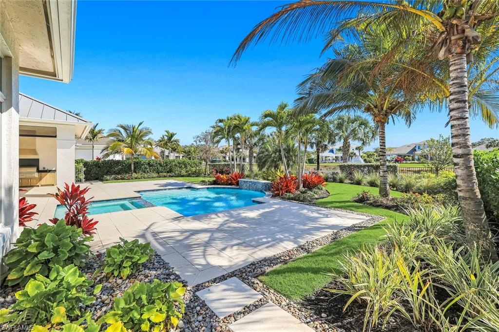 16716 Enclave Circle Naples, FL 34110 - Photo 50 of 50 Combined pool / hot tub featuring a patio area