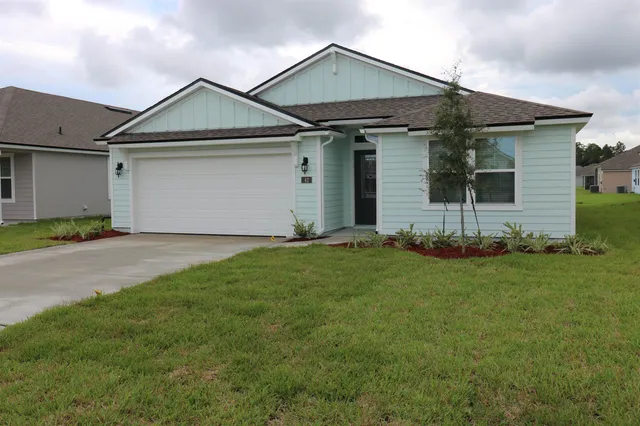 front view of a house and a yard