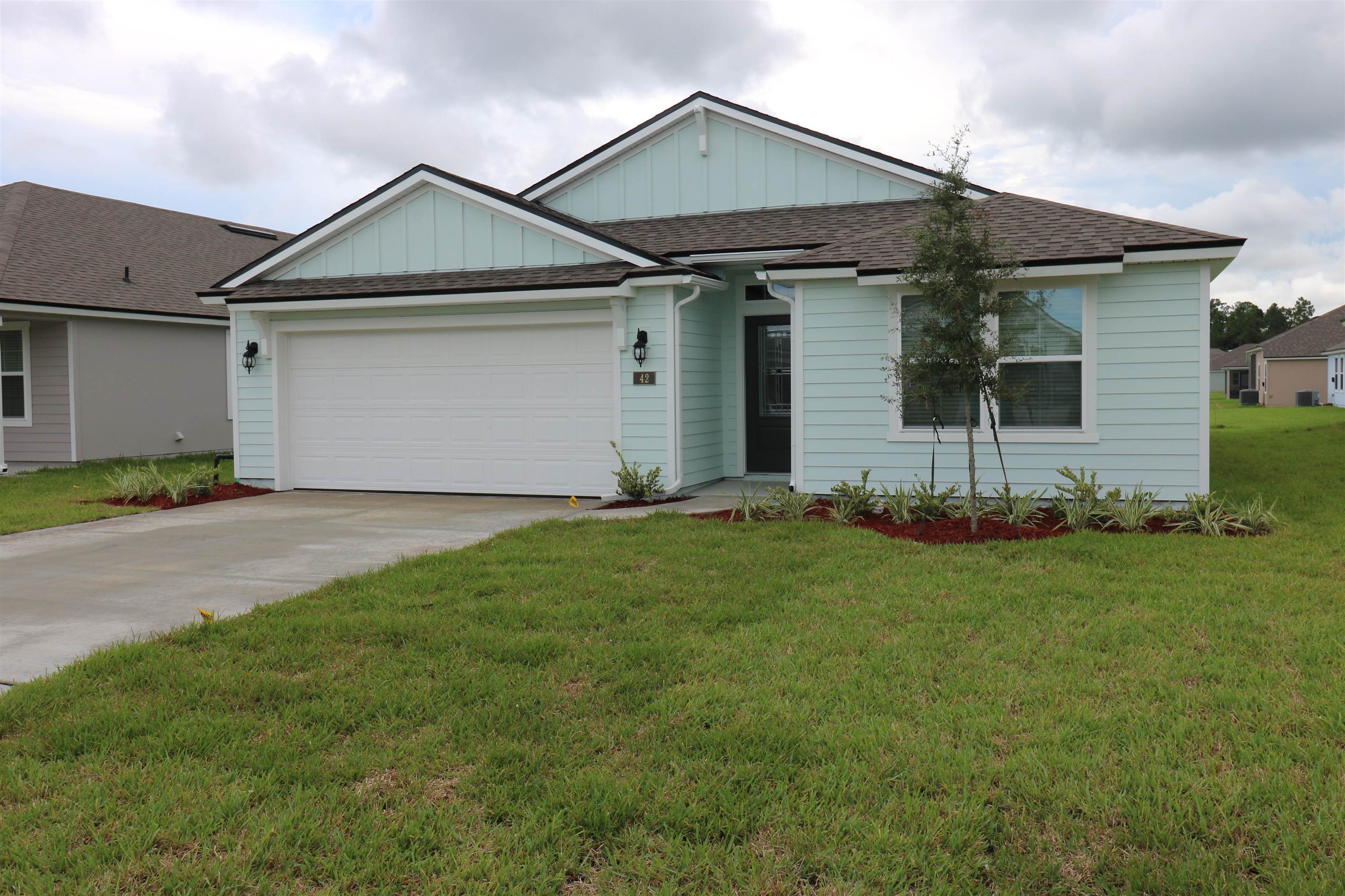 front view of a house and a yard