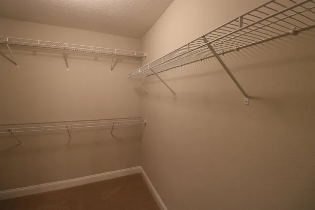 a view of a room with racks on the wall