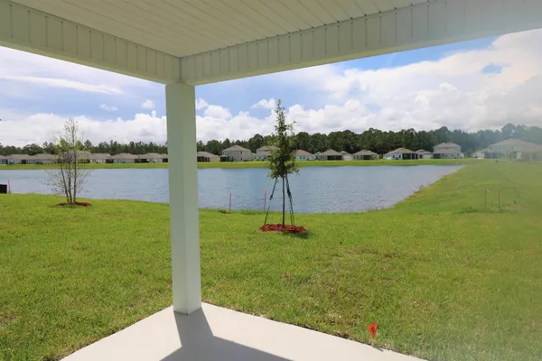 a view of a lake with a big yard