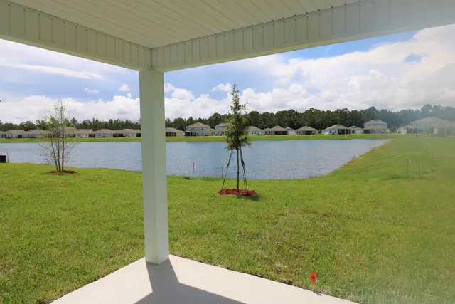 a view of a lake with a big yard