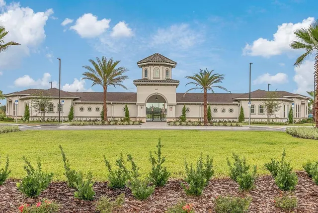 a view of a building with a yard