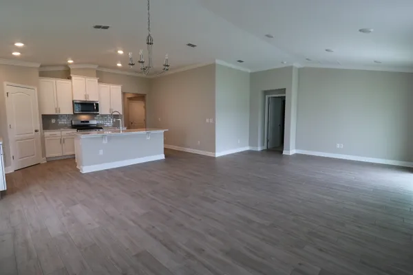 a view of kitchen and kitchen with stainless steel appliances refrigerator