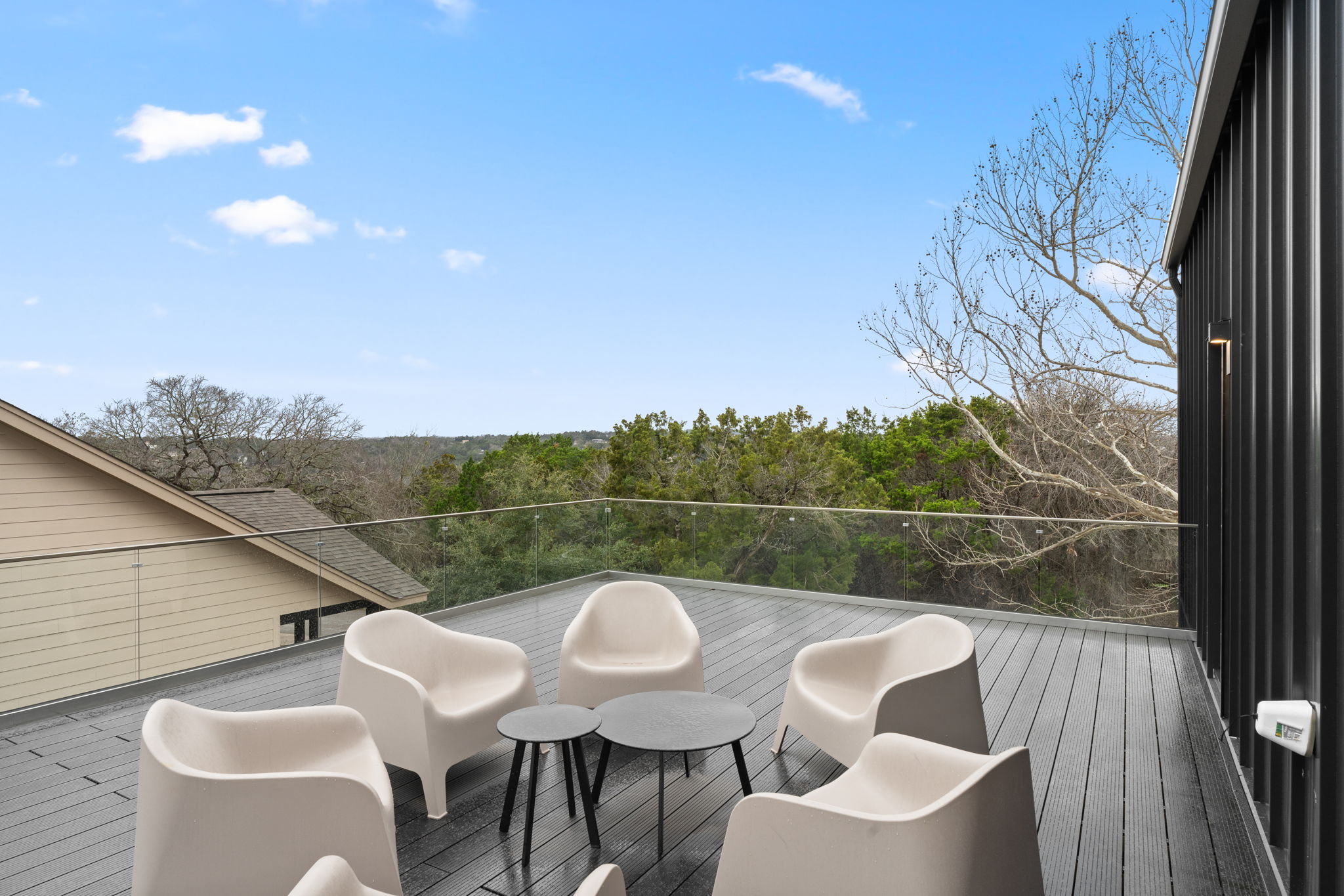 2915 Chisholm Trail Austin, TX 78734 - Photo 29 of 35 a view of a couches and a table in the balcony