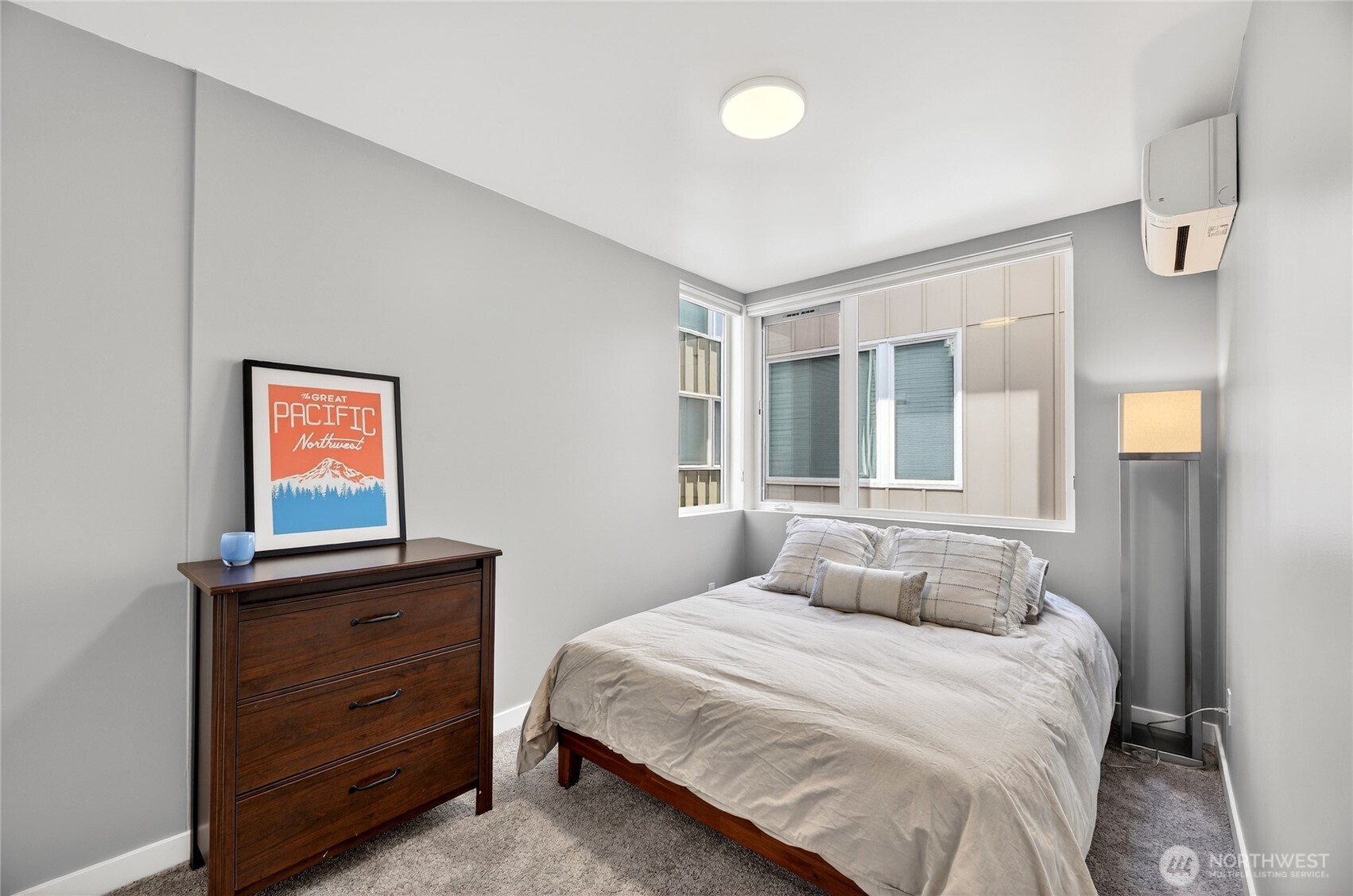 6320 41st Avenue Southwest, Unit B Seattle, WA 98136 - Photo 15 of 31 a bedroom with a bed and a window