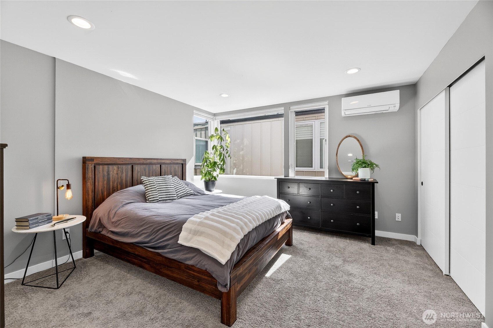 6320 41st Avenue Southwest, Unit B Seattle, WA 98136 - Photo 18 of 31 a bedroom with a bed and a dresser