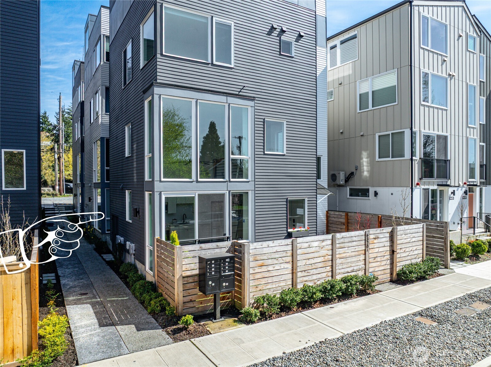 6320 41st Avenue Southwest, Unit B Seattle, WA 98136 - Photo 3 of 31 a view of a brick building with many windows