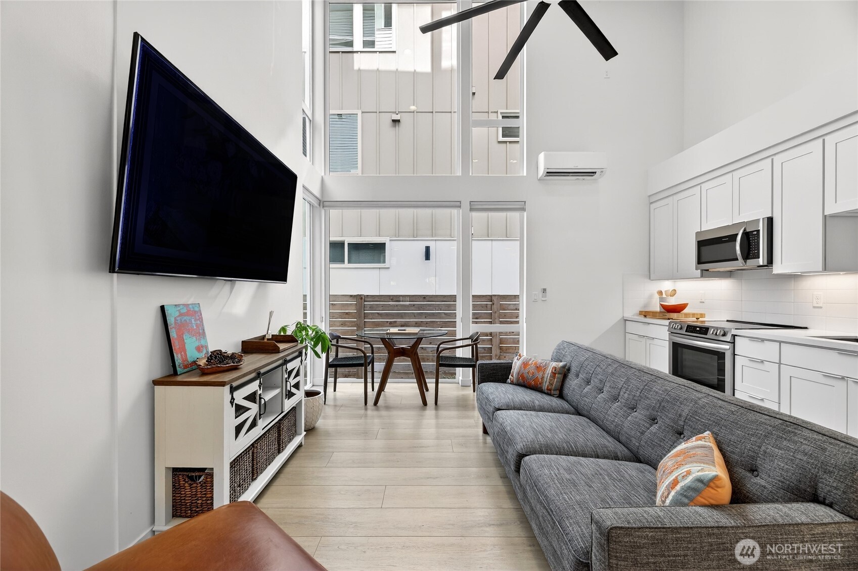 6320 41st Avenue Southwest, Unit B Seattle, WA 98136 - Photo 7 of 31 a living room with furniture and a flat screen tv