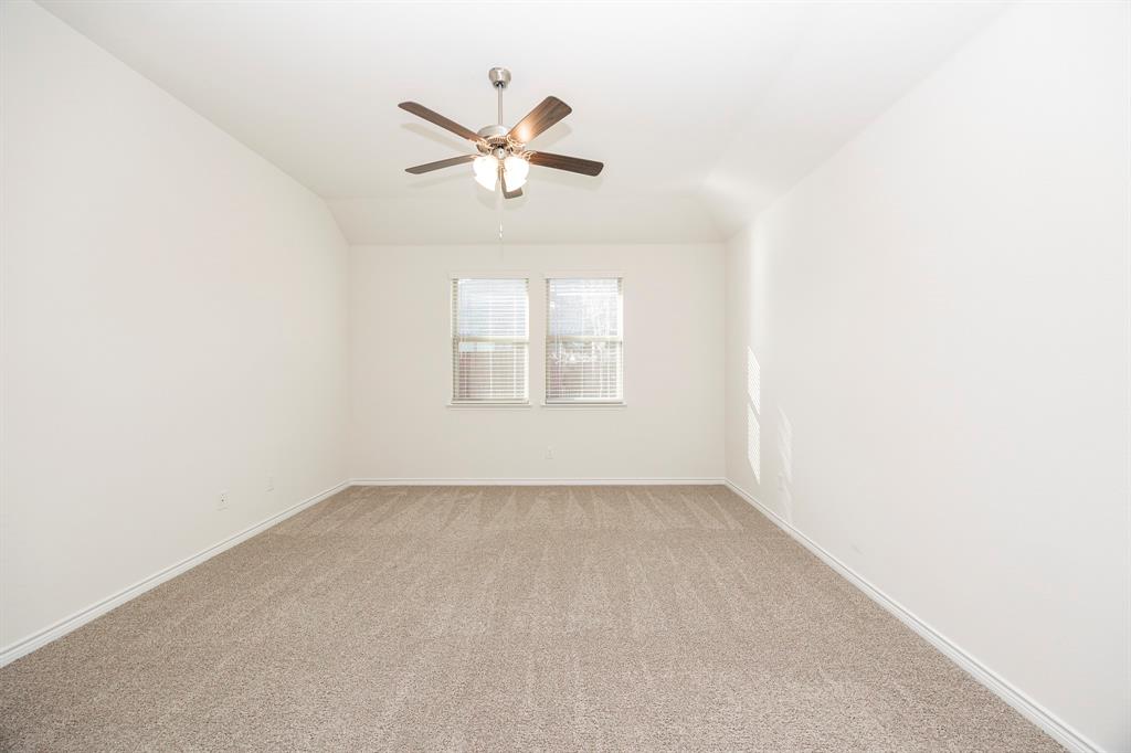1001 Marigold Street Princeton, TX 75407 - Photo 19 of 37 an empty room with windows and fan