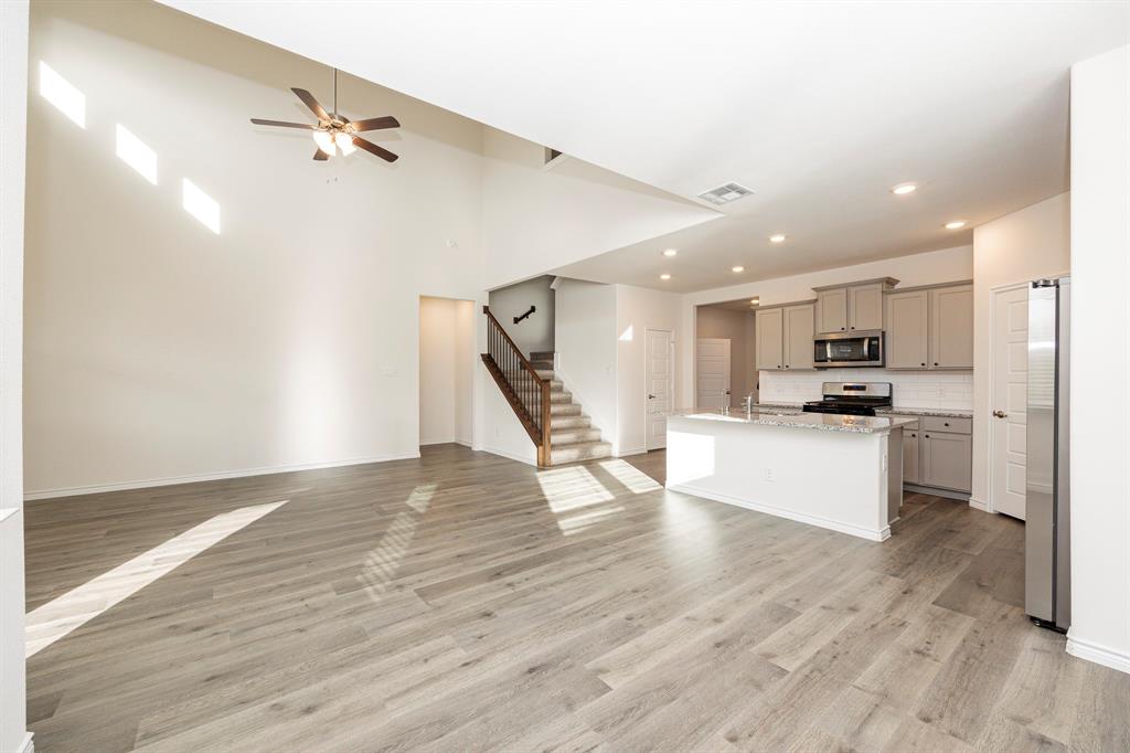 1001 Marigold Street Princeton, TX 75407 - Photo 2 of 37 a view of kitchen with cabinets and wooden floor
