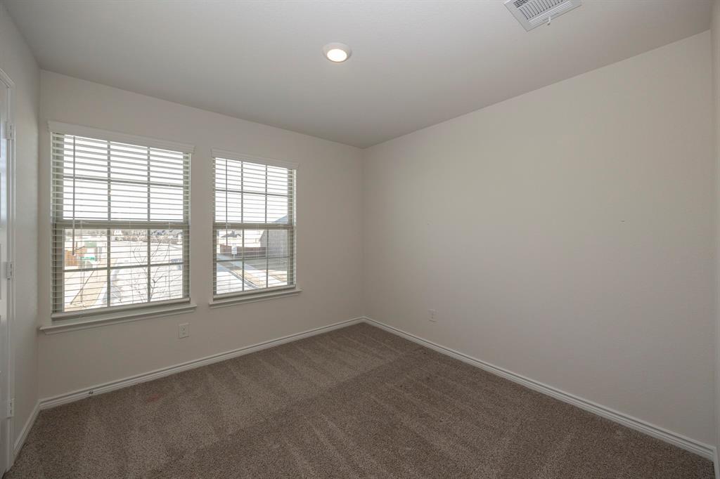 1001 Marigold Street Princeton, TX 75407 - Photo 32 of 37 an empty room with a window