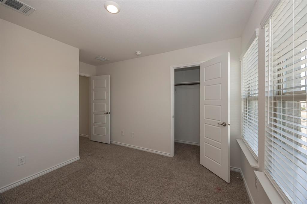 1001 Marigold Street Princeton, TX 75407 - Photo 37 of 37 an empty room with windows and closet