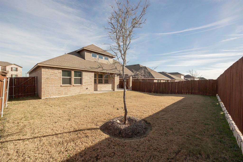 1001 Marigold Street Princeton, TX 75407 - Photo 8 of 37 a front view of a house with a yard