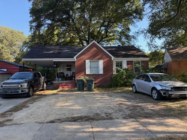 a car parked in front of a house