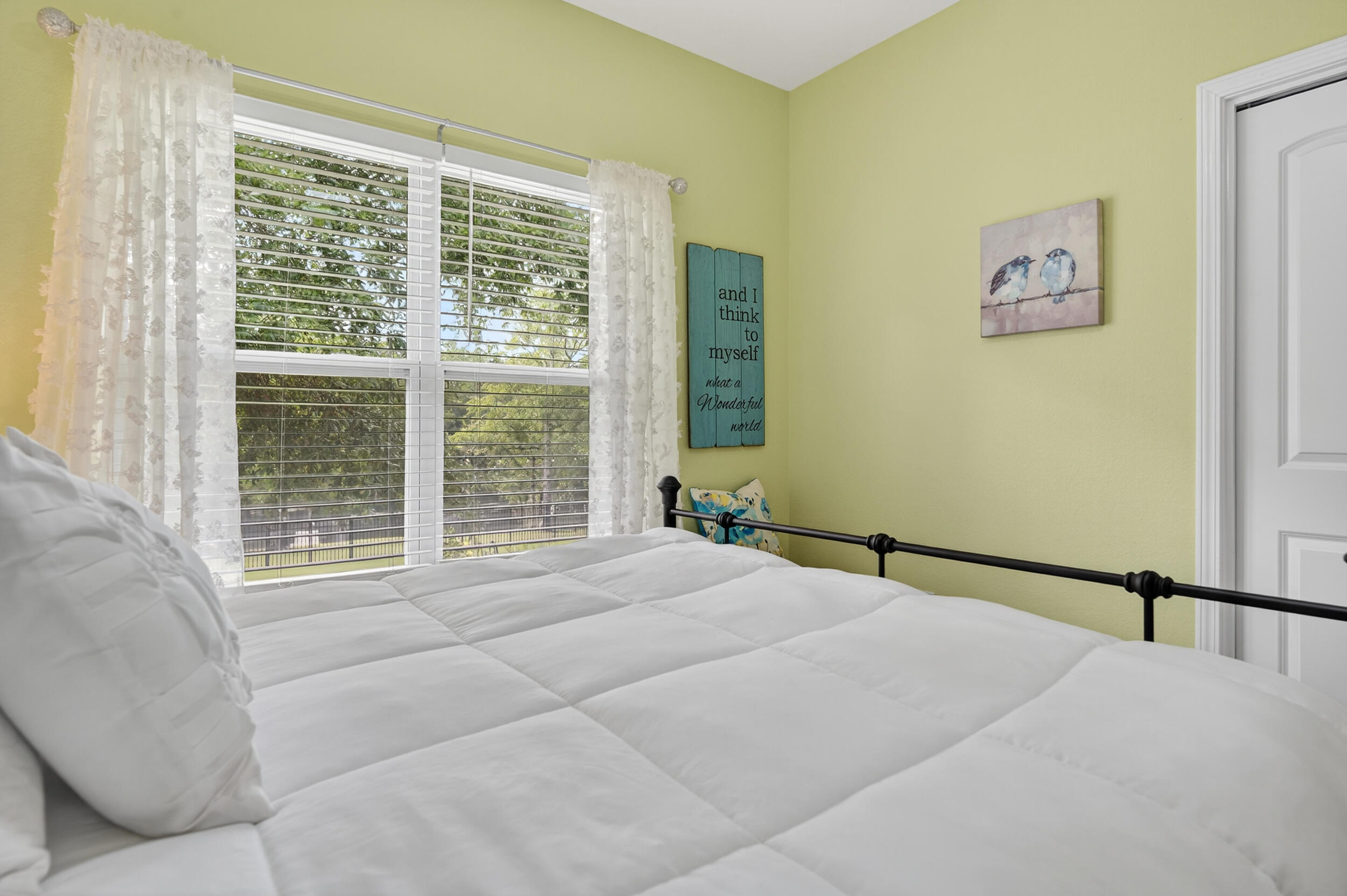 4036 Lakeview Drive Crestview, FL 32539 - Photo 17 of 45 a bedroom with a large bed and a large window