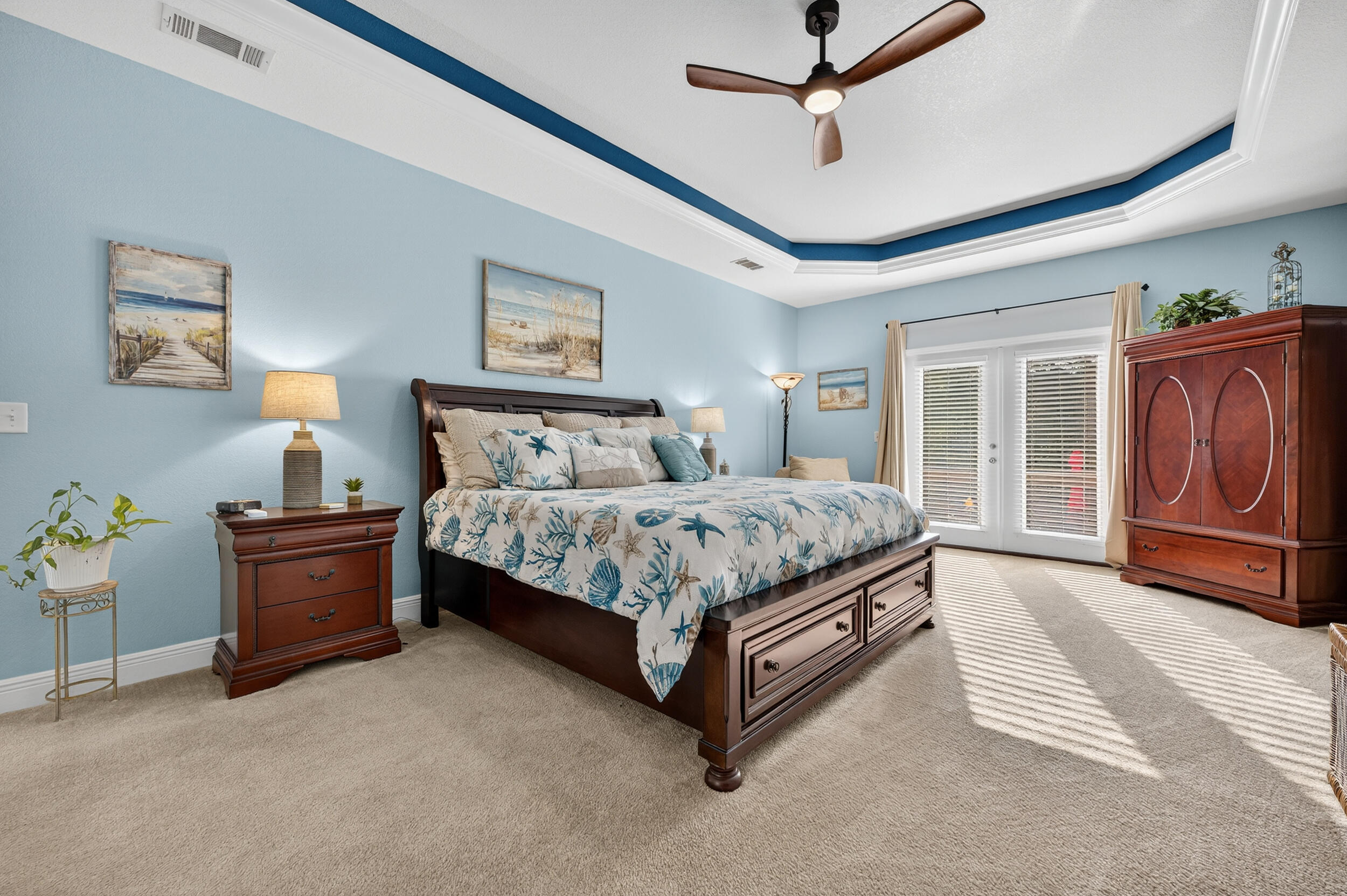 4036 Lakeview Drive Crestview, FL 32539 - Photo 24 of 45 a bedroom with a bed and a chandelier