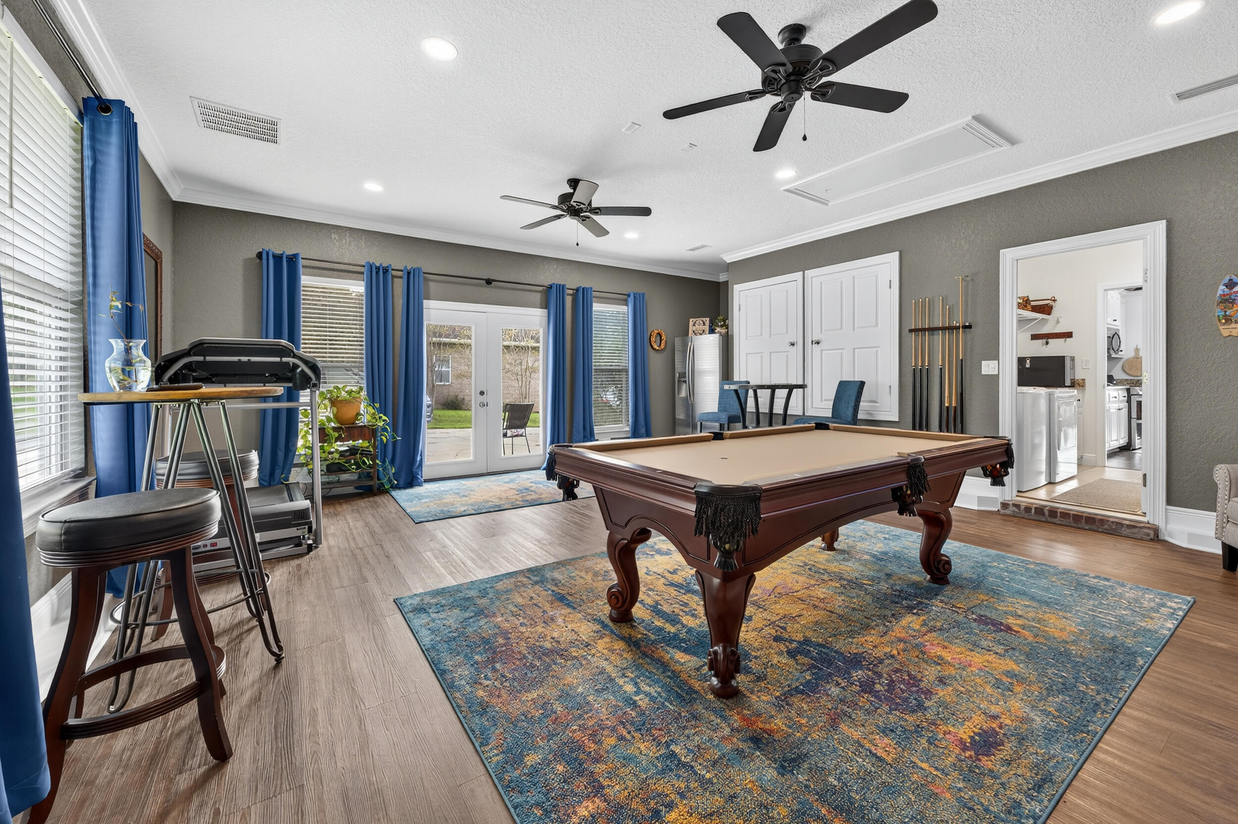 4036 Lakeview Drive Crestview, FL 32539 - Photo 26 of 45 a living room with a table a rug and a window