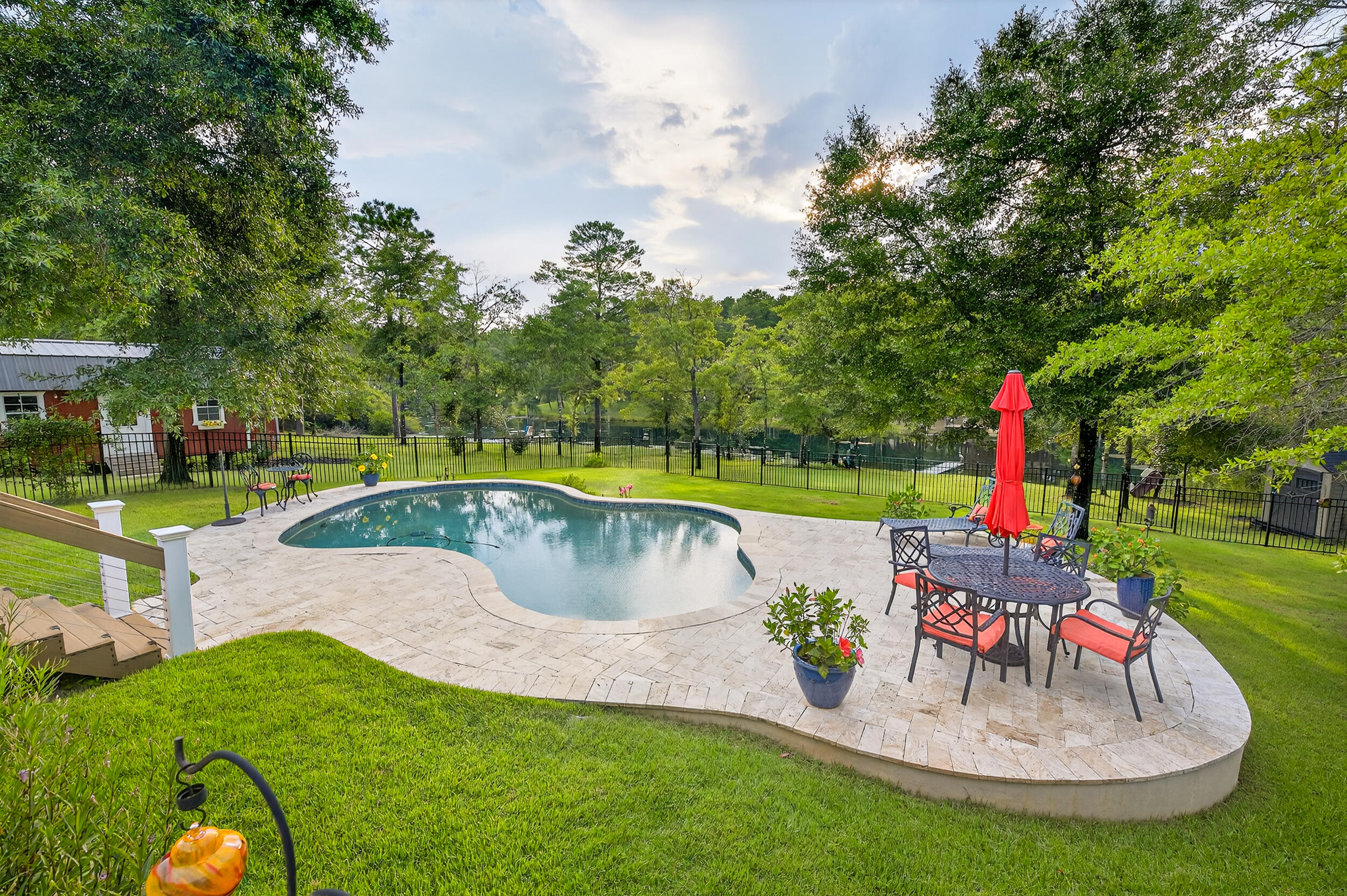4036 Lakeview Drive Crestview, FL 32539 - Photo 37 of 45 a view of swimming pool with a garden and sitting area