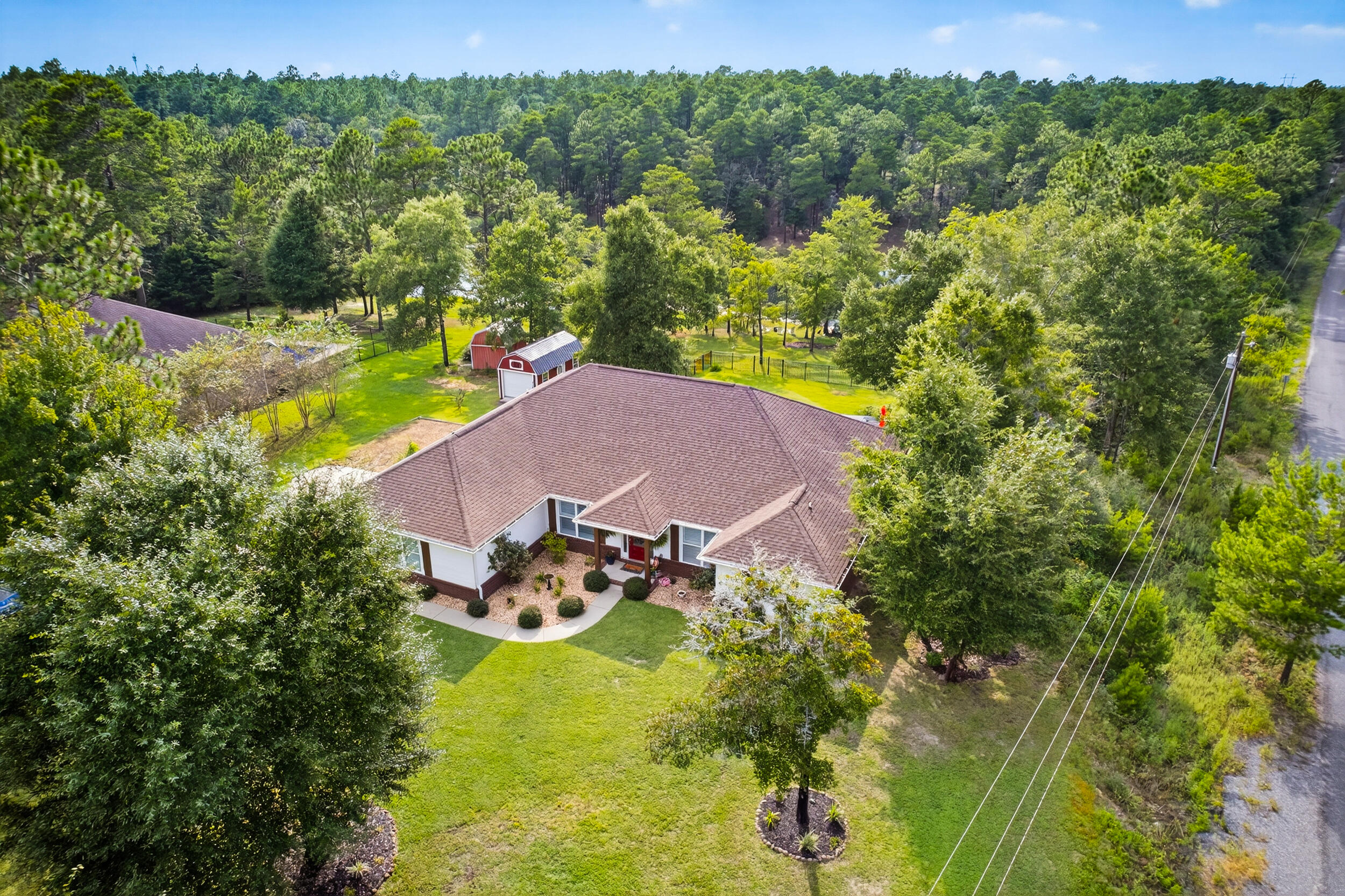 4036 Lakeview Drive Crestview, FL 32539 - Photo 38 of 45 an aerial view of residential houses with outdoor space and trees