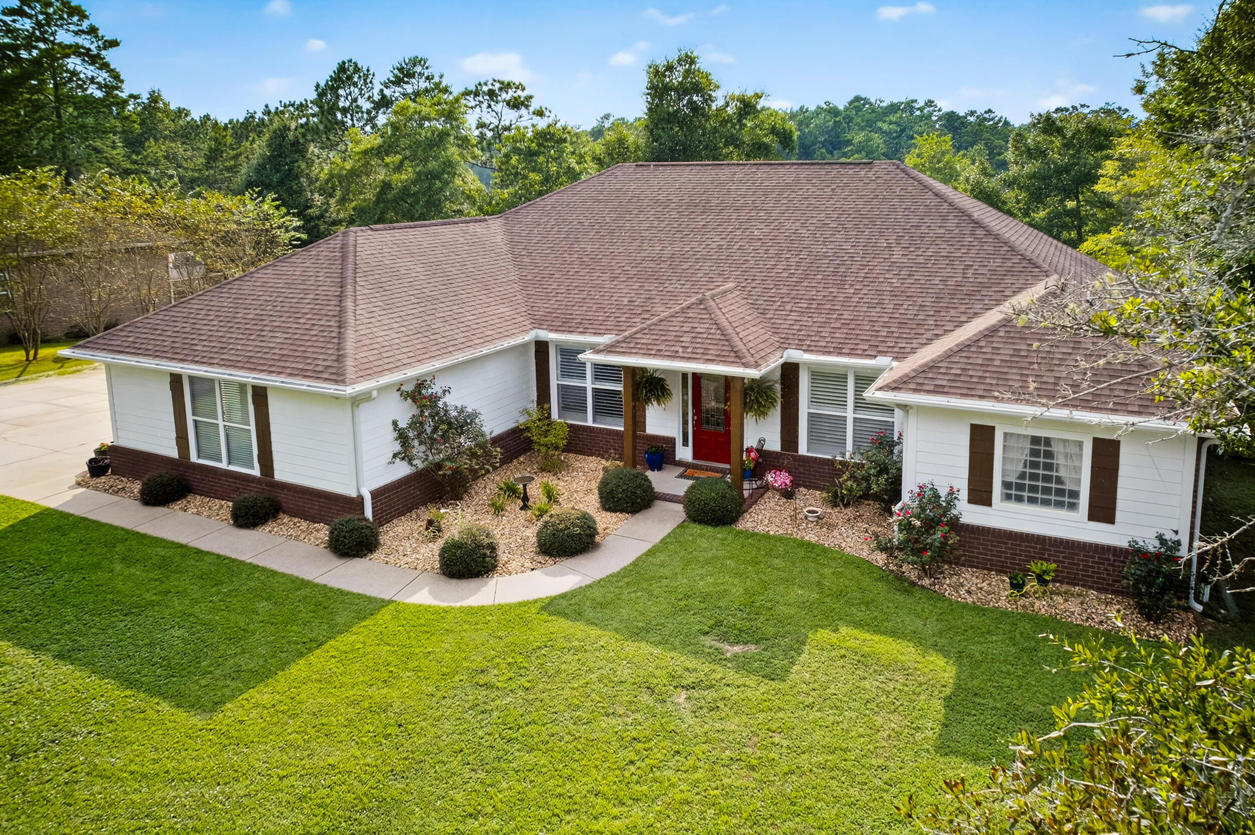 4036 Lakeview Drive Crestview, FL 32539 - Photo 4 of 45 a aerial view of a house with swimming pool and a yard