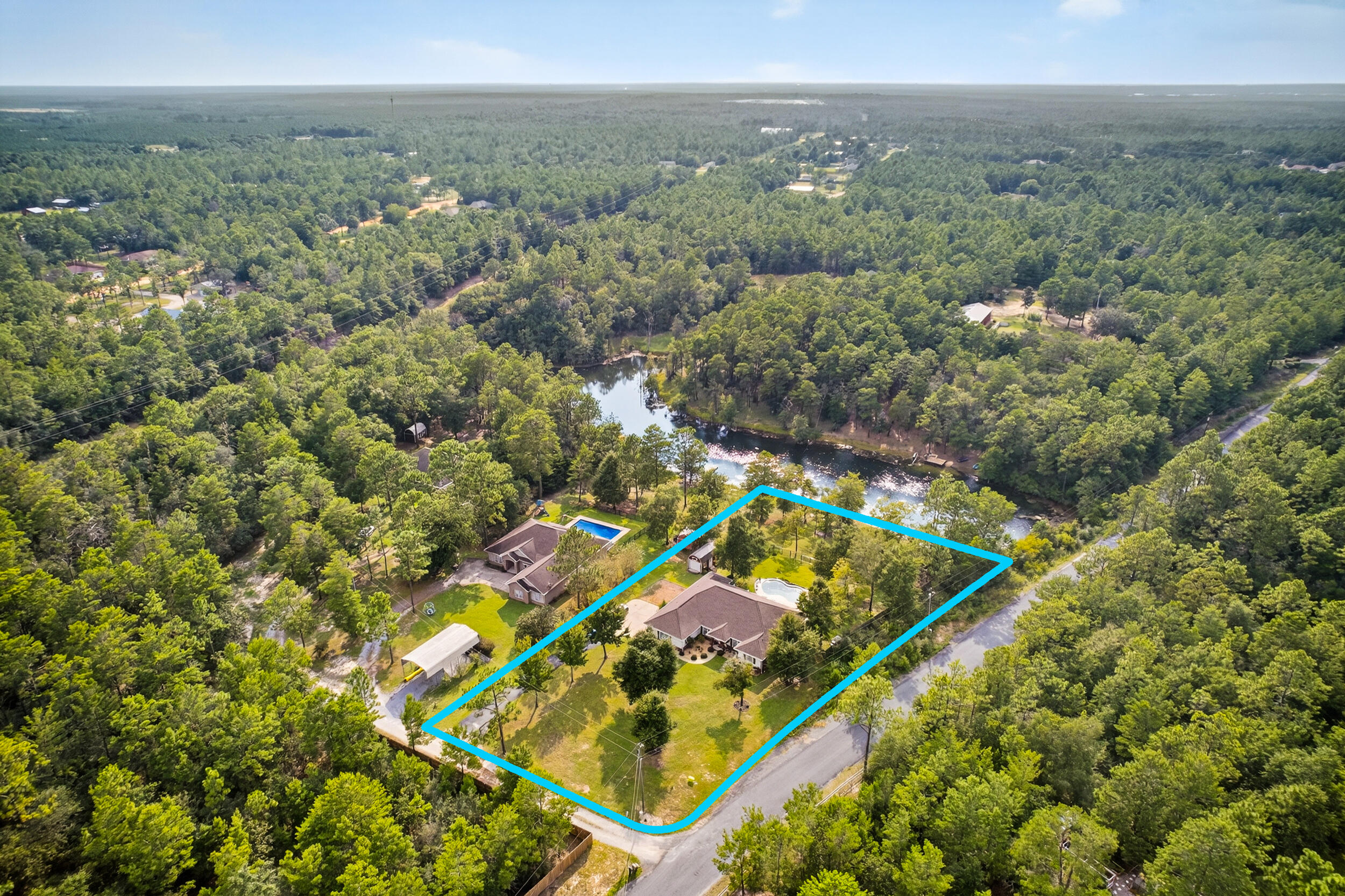 4036 Lakeview Drive Crestview, FL 32539 - Photo 44 of 45 an aerial view of residential houses with outdoor space and trees