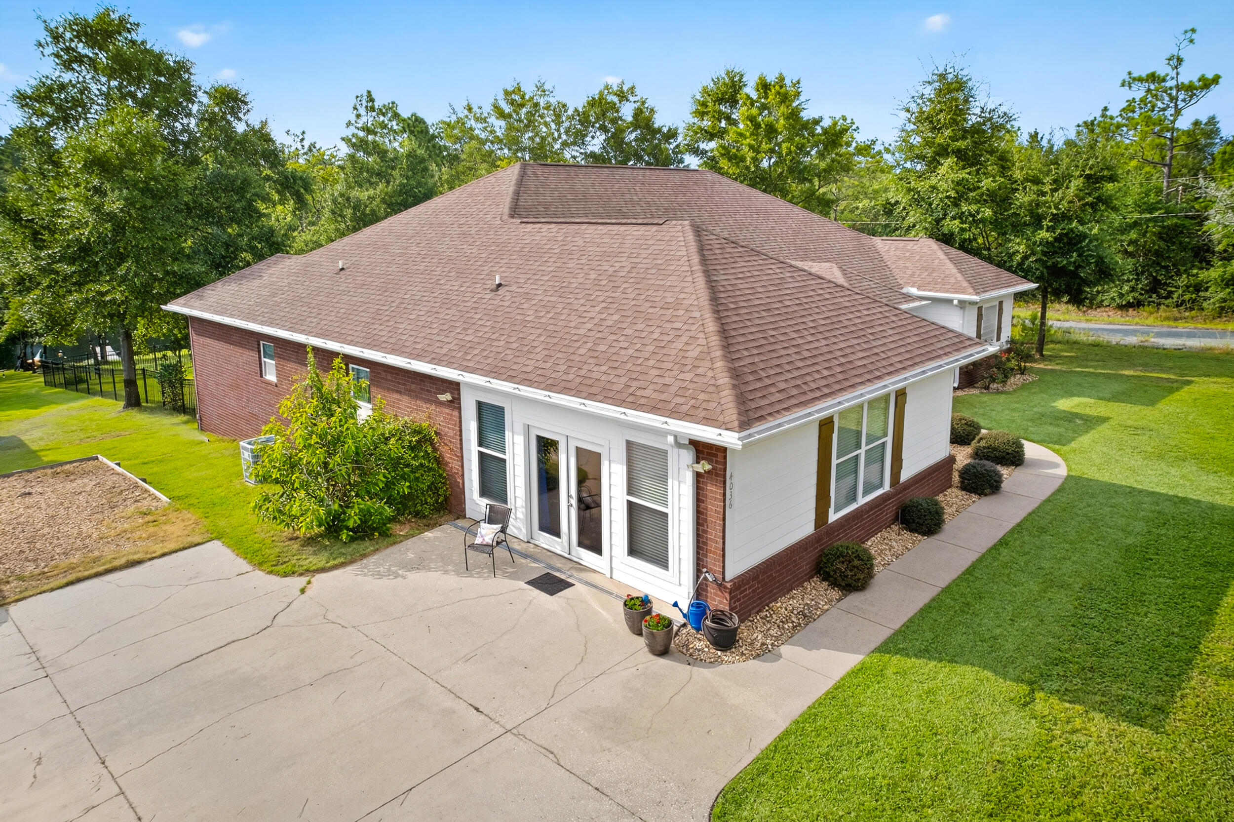 4036 Lakeview Drive Crestview, FL 32539 - Photo 5 of 45 a aerial view of a house with yard and trees in the background