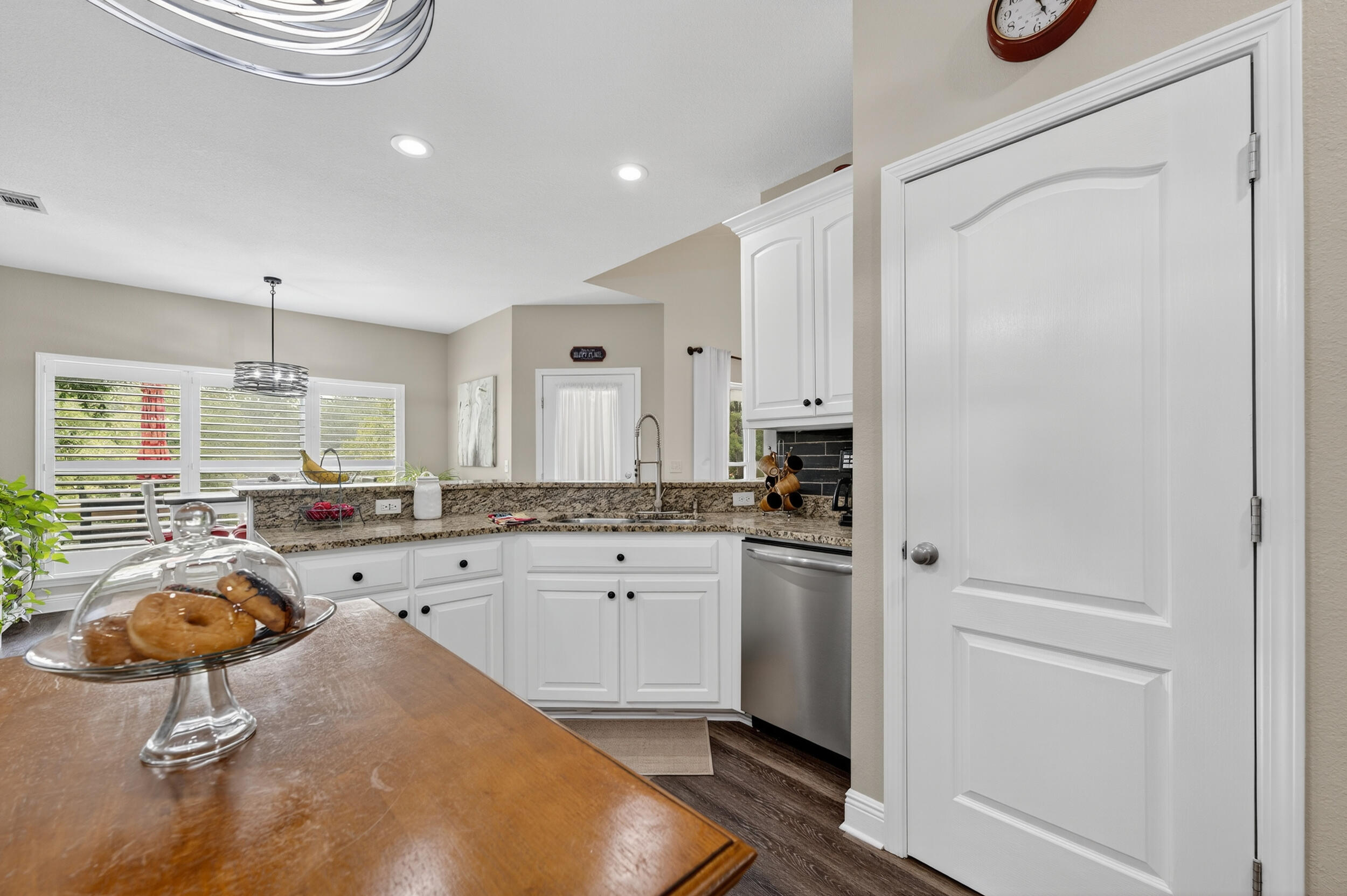 4036 Lakeview Drive Crestview, FL 32539 - Photo 10 of 45 a kitchen with refrigerator and tub