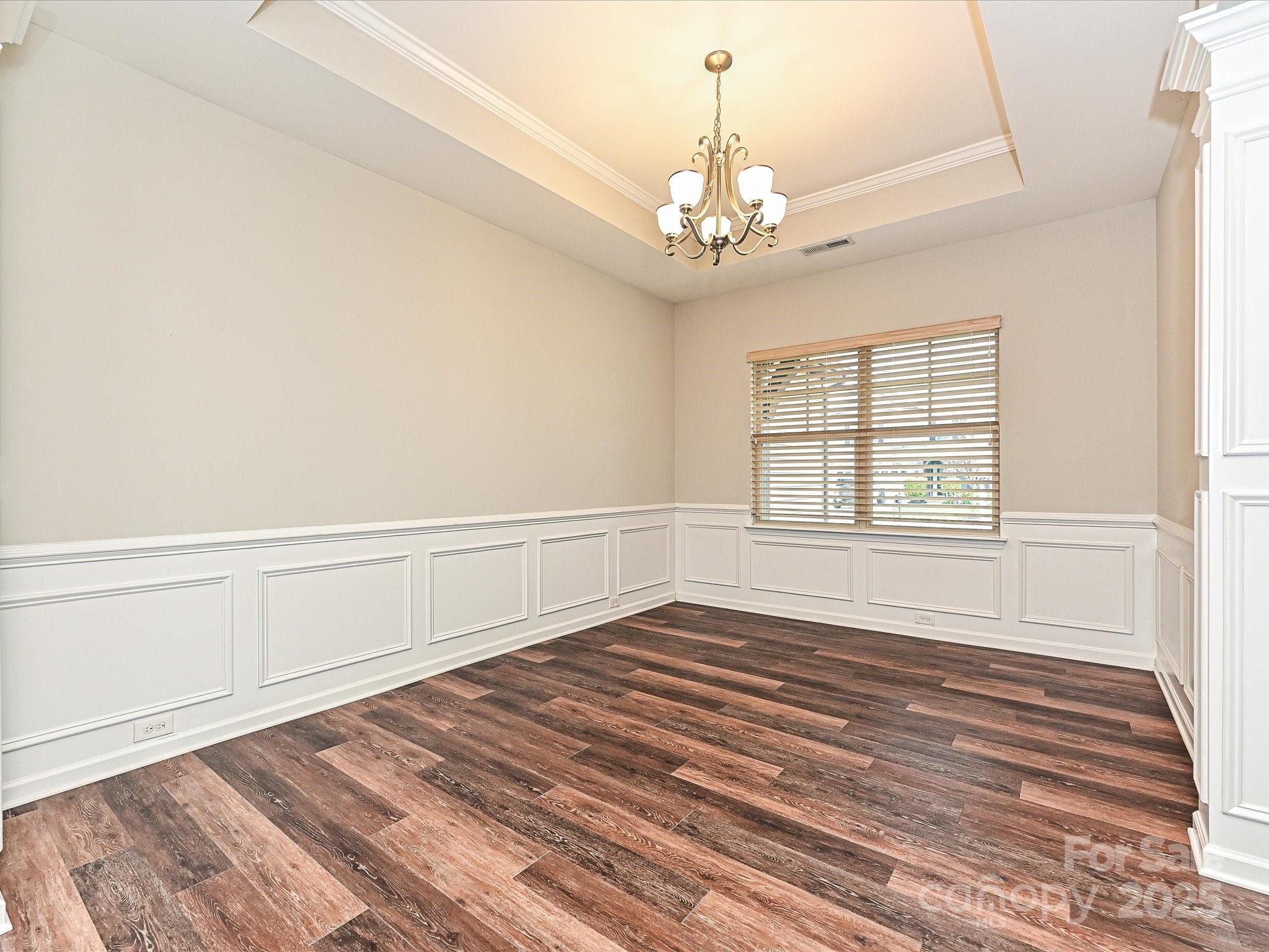 4425 Marlay Park Indian Trail, NC 28079 - Photo 15 of 33 a view of an empty room with wooden floor and a window