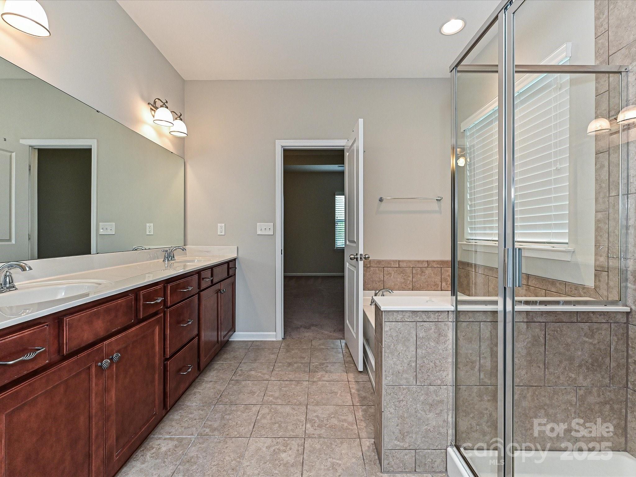 4425 Marlay Park Indian Trail, NC 28079 - Photo 25 of 33 a bathroom with a double vanity sink and a mirror