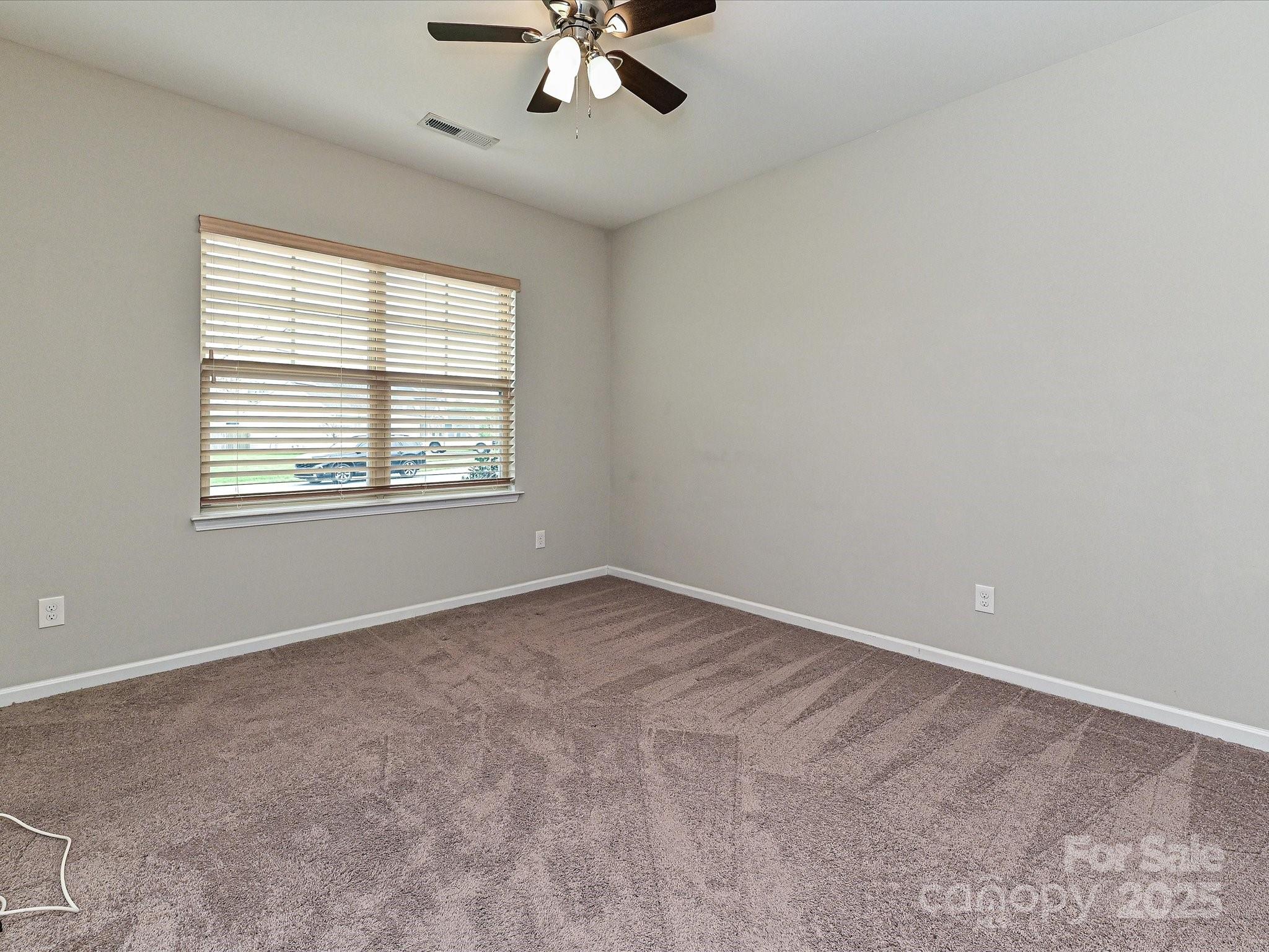 4425 Marlay Park Indian Trail, NC 28079 - Photo 26 of 33 an empty room with a window and a fan