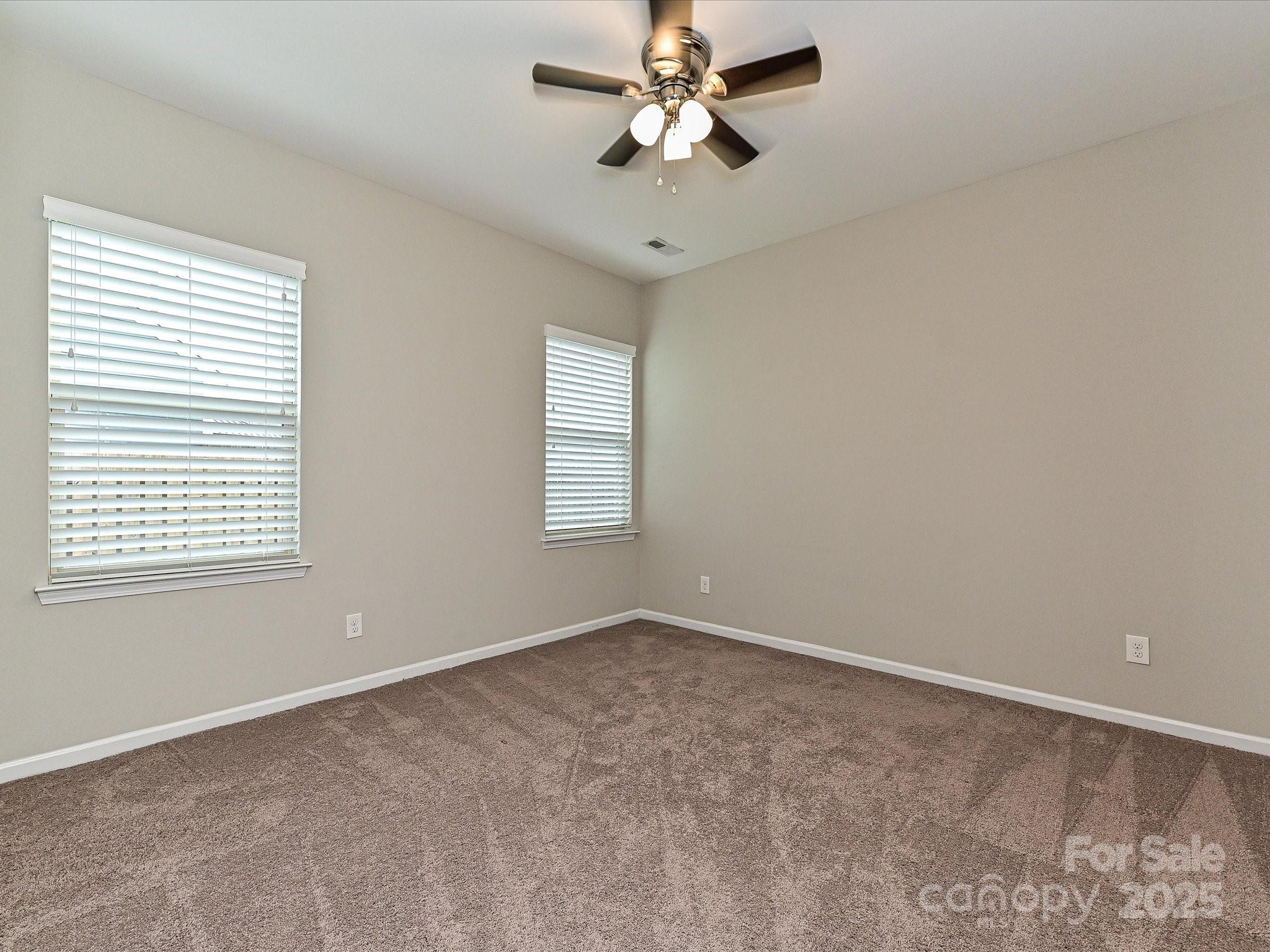 4425 Marlay Park Indian Trail, NC 28079 - Photo 28 of 33 a view of empty room with window and ceiling fan