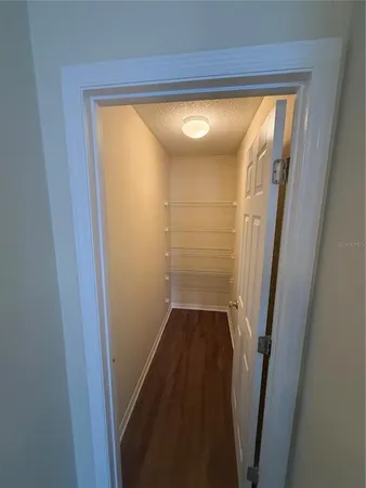 a view of wooden floor and windows in a room
