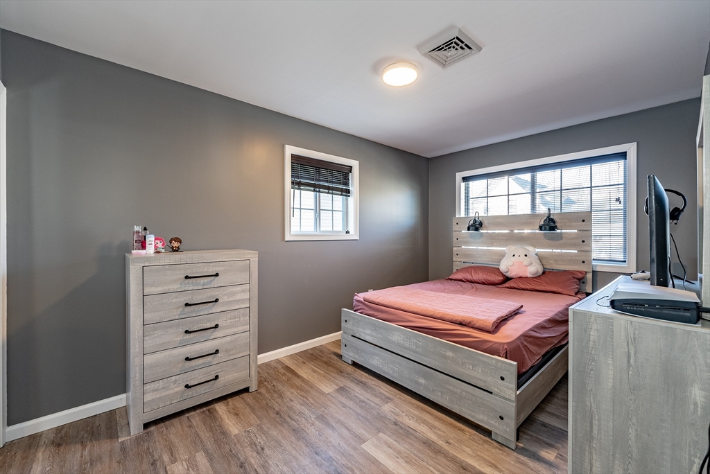 42 Ringgold Street Springfield, MA 01107 - Photo 12 of 13 a bedroom with a bed and a window