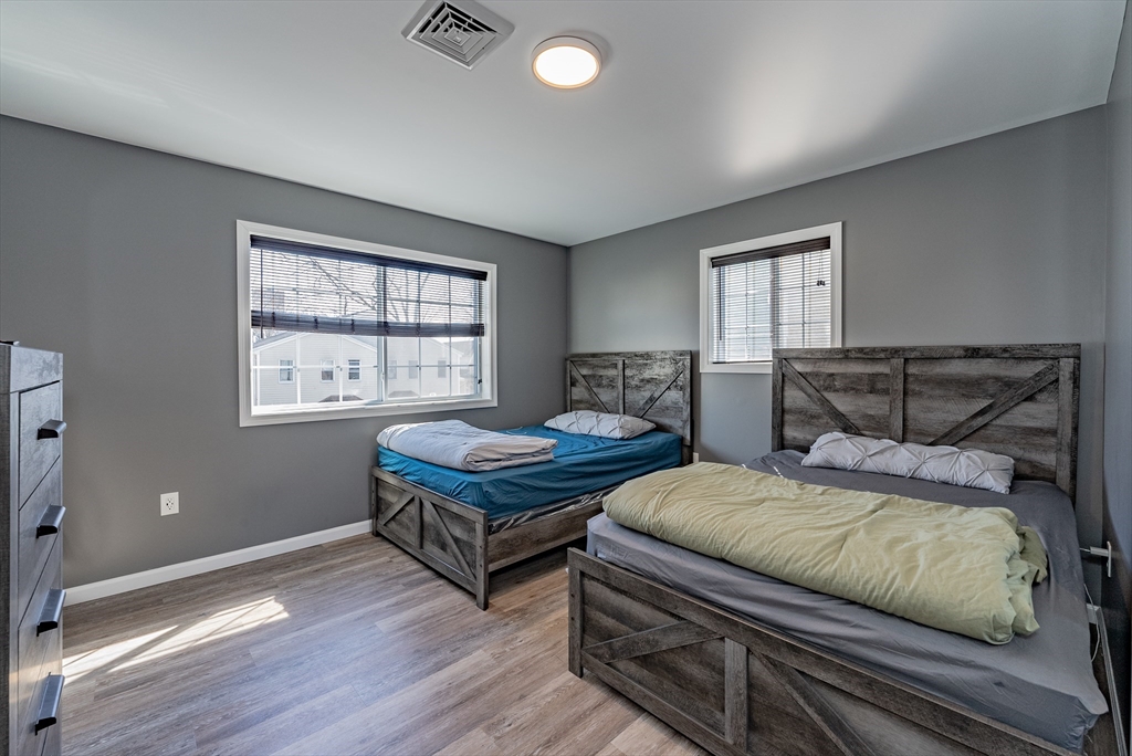 42 Ringgold Street Springfield, MA 01107 - Photo 13 of 13 a bedroom with a bed and windows