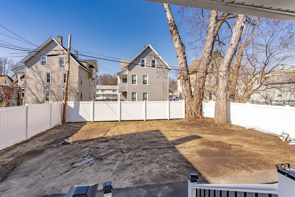 42 Ringgold Street Springfield, MA 01107 - Photo 3 of 13 a view of a house with snow on the road