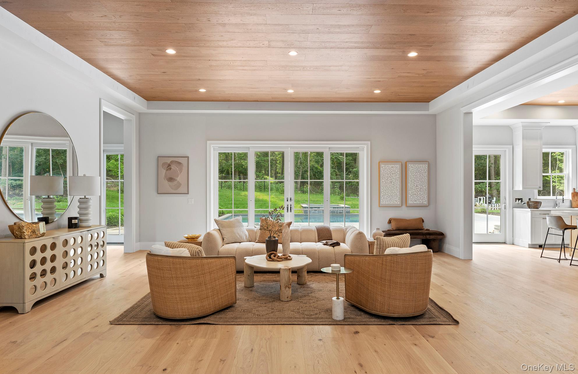 2524 Noyack Road Sag Harbor, NY 11963 - Photo 11 of 38 a living room with furniture and windows