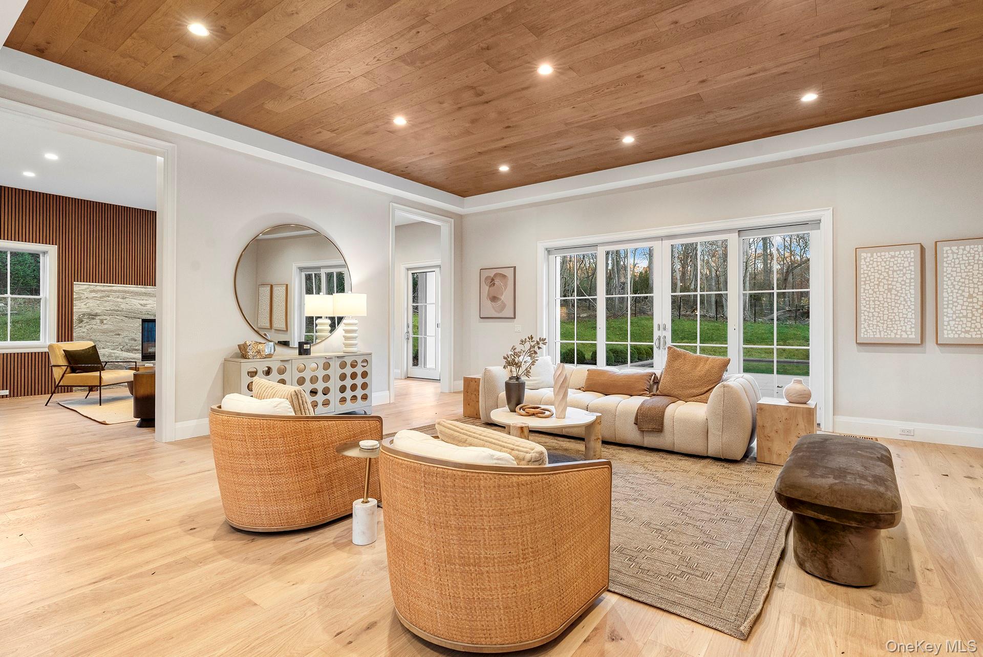 2524 Noyack Road Sag Harbor, NY 11963 - Photo 12 of 38 a living room with furniture and a large window